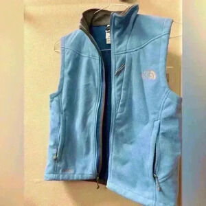 Blue North Face vest in size Small.